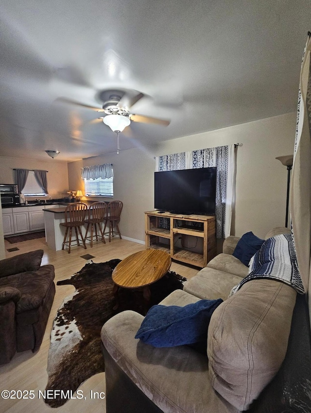 104 Palm Dr, Georgetown, FL 32139 - living area featuring a ceiling fan and light wood-style flooring