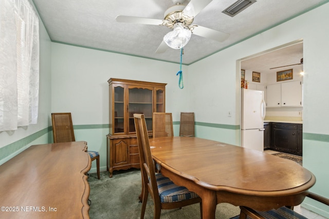 1073 Grove Park Ln, Orange Park, FL 32073 - dining room featuring a ceiling fan, carpet floors, and baseboards