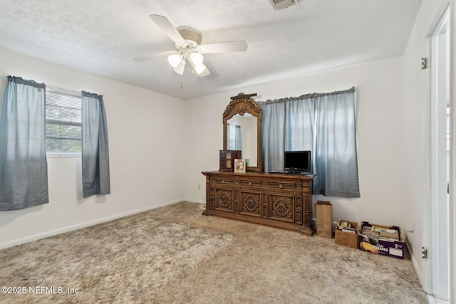 1073 Grove Park Ln, Orange Park, FL 32073 - bedroom with carpet flooring, a textured ceiling, ceiling fan, and baseboards