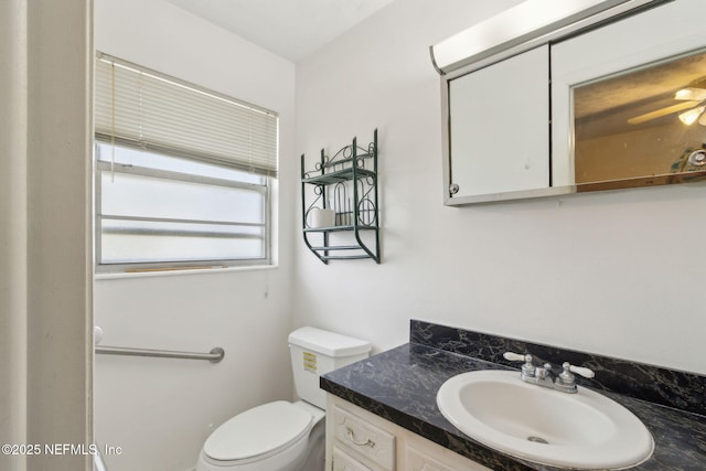 1073 Grove Park Ln, Orange Park, FL 32073 - bathroom with vanity, toilet, and a ceiling fan