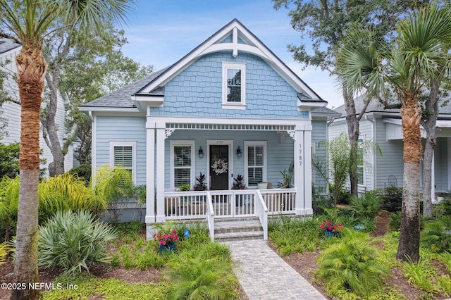 1787 Azalea St, Fernandina Beach, FL 32034 - view of front of home with a porch and a shingled roof