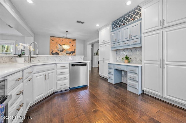 4371 Gadsden Ct, Jacksonville, FL 32207 - kitchen with stainless steel dishwasher, dark wood finished floors, recessed lighting, light countertops, and decorative backsplash