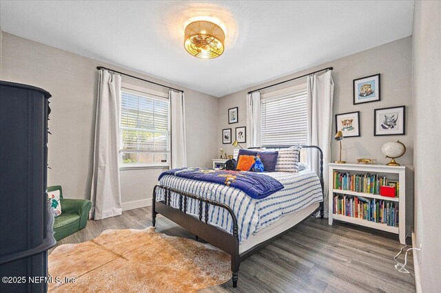 4371 Gadsden Ct, Jacksonville, FL 32207 - bedroom featuring wood finished floors and baseboards