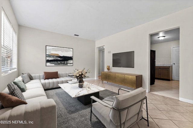 602 Luna Ct, Jacksonville, FL 32205 - living room with light tile patterned flooring and baseboards