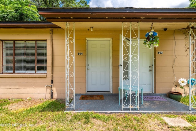 602 Luna Ct, Jacksonville, FL 32205 - property entrance with concrete block siding