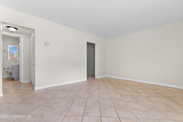 602 Luna Ct, Jacksonville, FL 32205 - spare room featuring light tile patterned flooring and baseboards