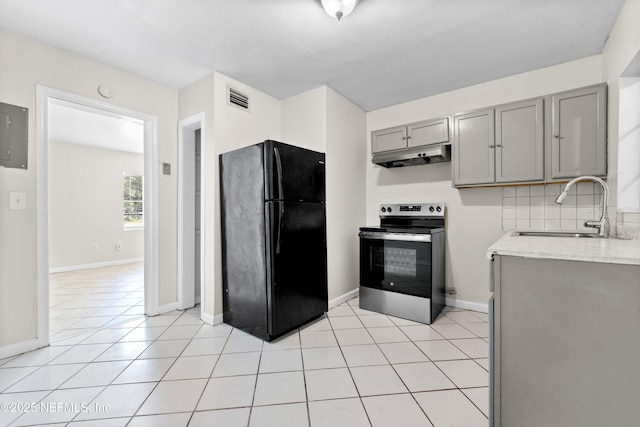 602 Luna Ct, Jacksonville, FL 32205 - kitchen featuring freestanding refrigerator, stainless steel electric range oven, gray cabinetry, a sink, and under cabinet range hood