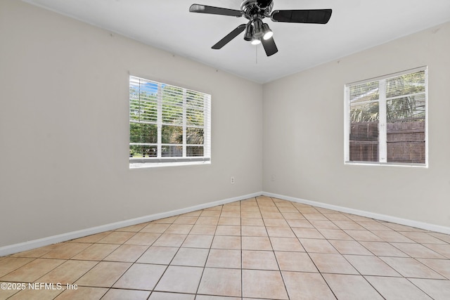 602 Luna Ct, Jacksonville, FL 32205 - spare room featuring plenty of natural light, baseboards, a ceiling fan, and light tile patterned floors