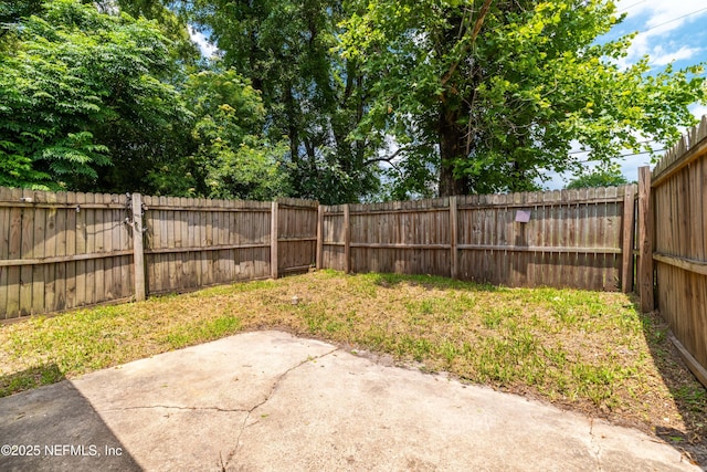 602 Luna Ct, Jacksonville, FL 32205 - fenced backyard featuring a patio