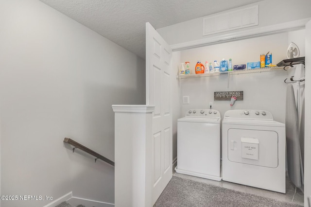 287 Richmond Dr, Saint Johns, FL 32259 - laundry room with washing machine and dryer and a textured ceiling