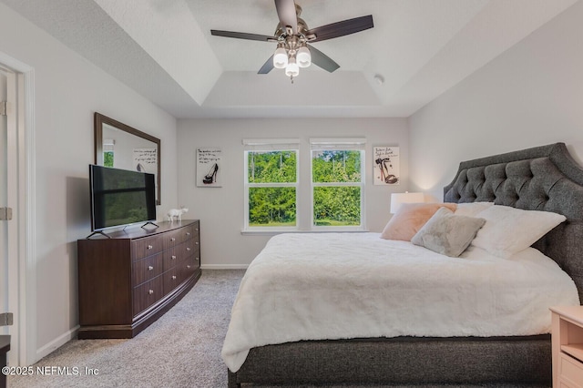 287 Richmond Dr, Saint Johns, FL 32259 - carpeted bedroom with a tray ceiling, baseboards, and ceiling fan