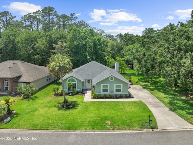 1500 Marsh Rabbit Way, Fleming Island, FL 32003 - view of front of house featuring a front yard, driveway, and a chimney