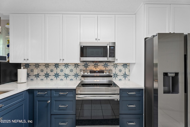 1500 Marsh Rabbit Way, Fleming Island, FL 32003 - kitchen with appliances with stainless steel finishes, white cabinetry, and backsplash