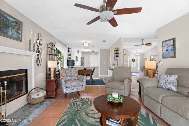 1500 Marsh Rabbit Way, Fleming Island, FL 32003 - living room featuring ceiling fan, tile patterned floors, and a glass covered fireplace
