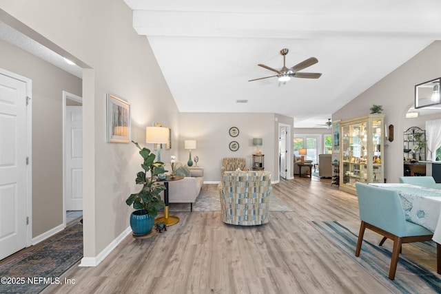 1500 Marsh Rabbit Way, Fleming Island, FL 32003 - living area featuring vaulted ceiling, a ceiling fan, wood finished floors, and baseboards