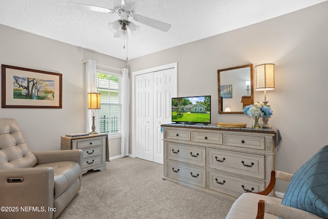 1500 Marsh Rabbit Way, Fleming Island, FL 32003 - sitting room featuring ceiling fan, light carpet, baseboards, and a textured ceiling