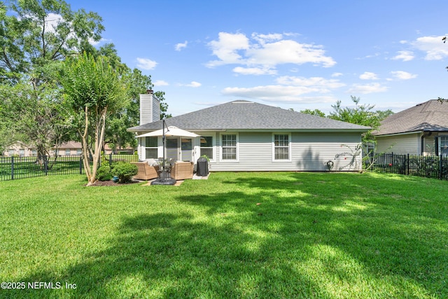 1500 Marsh Rabbit Way, Fleming Island, FL 32003 - rear view of property with a chimney and roof with shingles