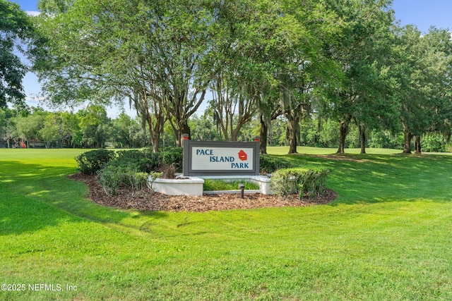 1500 Marsh Rabbit Way, Fleming Island, FL 32003 - community / neighborhood sign with a yard and view of scattered trees