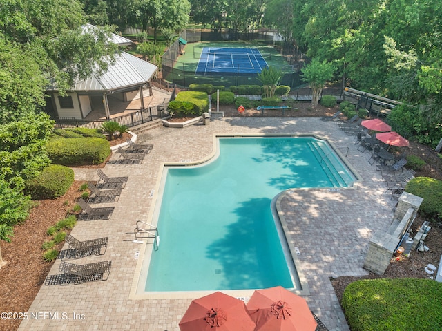 1500 Marsh Rabbit Way, Fleming Island, FL 32003 - community pool featuring a patio and view of scattered trees
