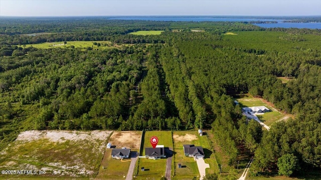 5801 SE County Road 21b, Keystone Heights, FL 32656 - aerial view of property and surrounding area featuring a heavily wooded area