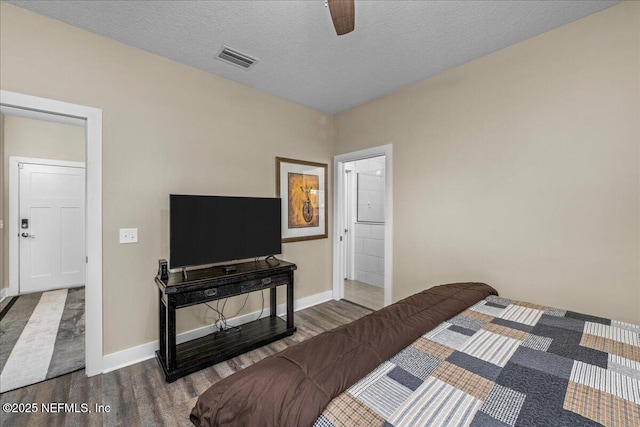 5801 SE County Road 21b, Keystone Heights, FL 32656 - bedroom featuring wood finished floors, baseboards, a textured ceiling, and ceiling fan