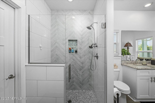 5801 SE County Road 21b, Keystone Heights, FL 32656 - bathroom featuring toilet, vanity, and a stall shower