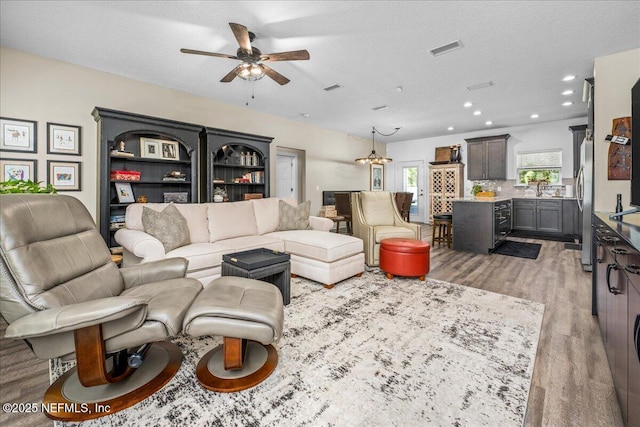 5801 SE County Road 21b, Keystone Heights, FL 32656 - living room featuring a ceiling fan, light wood-style flooring, and recessed lighting