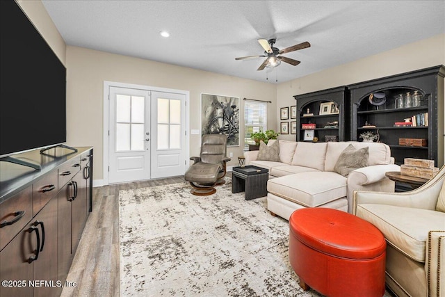 5801 SE County Road 21b, Keystone Heights, FL 32656 - living area with ceiling fan, french doors, wood finished floors, a textured ceiling, and recessed lighting