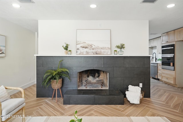 1233 Boca Grande Ave, Jacksonville, FL 32233 - living room featuring recessed lighting, a tiled fireplace, and baseboards