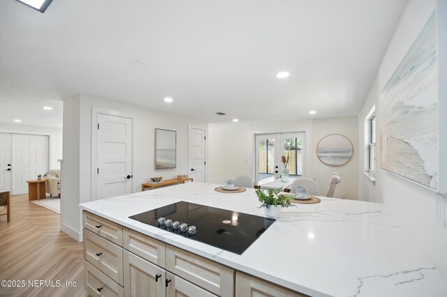 1233 Boca Grande Ave, Jacksonville, FL 32233 - kitchen featuring black electric cooktop, recessed lighting, light stone countertops, and french doors