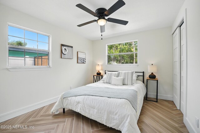1233 Boca Grande Ave, Jacksonville, FL 32233 - bedroom with multiple windows, baseboards, a closet, and ceiling fan