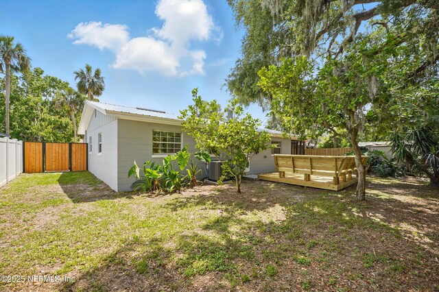 1233 Boca Grande Ave, Jacksonville, FL 32233 - rear view of house with a deck and metal roof