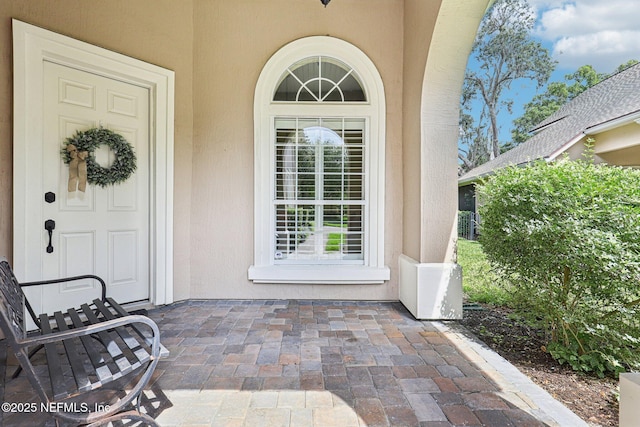 4640 Tuscan Wood Ct, Saint Augustine, FL 32092 - view of exterior entry featuring stucco siding