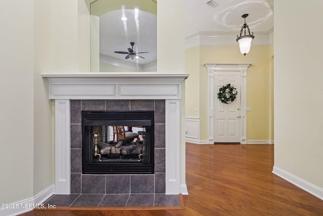4640 Tuscan Wood Ct, Saint Augustine, FL 32092 - detailed view of ceiling fan, wood finished floors, ornamental molding, and a tile fireplace