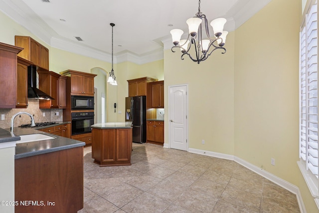 4640 Tuscan Wood Ct, Saint Augustine, FL 32092 - kitchen with black appliances, wall chimney range hood, tasteful backsplash, a chandelier, and dark countertops