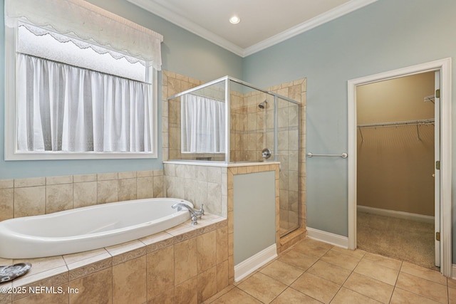 4640 Tuscan Wood Ct, Saint Augustine, FL 32092 - full bathroom with a bath, a stall shower, a walk in closet, crown molding, and tile patterned floors