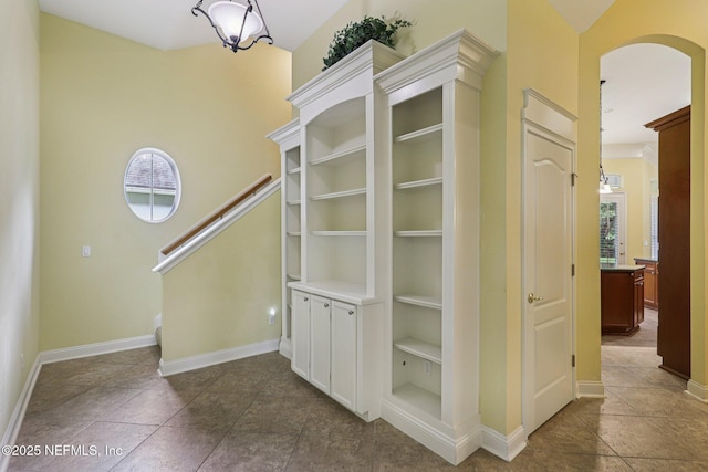 4640 Tuscan Wood Ct, Saint Augustine, FL 32092 - interior space featuring arched walkways and dark tile patterned flooring