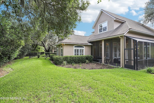 4640 Tuscan Wood Ct, Saint Augustine, FL 32092 - view of side of home featuring a sunroom, stucco siding, and a shingled roof