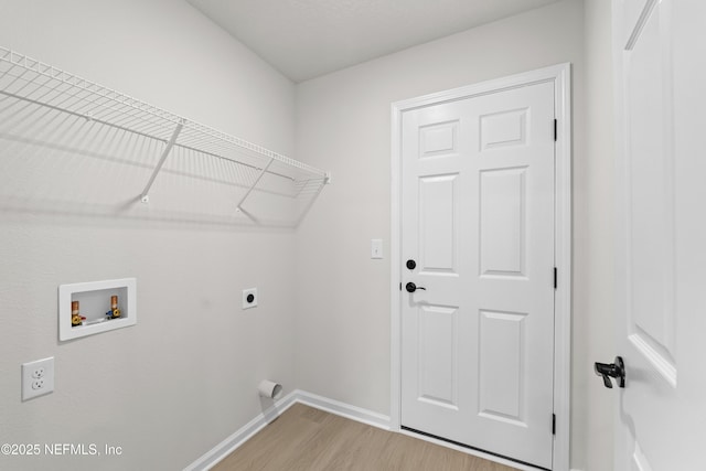 5969 Flicker Ave, Jacksonville, FL 32219 - laundry area with electric dryer hookup, hookup for a washing machine, light wood-style floors, and baseboards