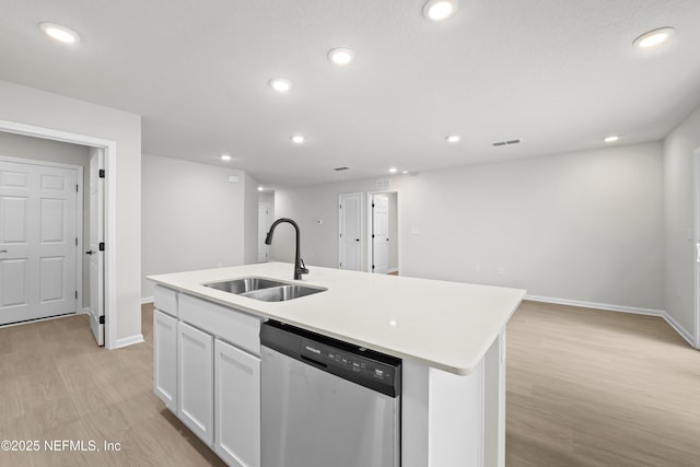 5969 Flicker Ave, Jacksonville, FL 32219 - kitchen with dishwasher, a sink, light wood-style flooring, baseboards, and white cabinetry