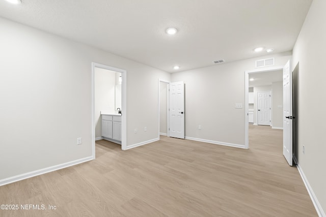 5969 Flicker Ave, Jacksonville, FL 32219 - unfurnished bedroom featuring light wood-style floors, baseboards, recessed lighting, and ensuite bathroom