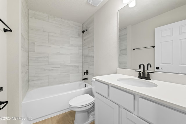 5969 Flicker Ave, Jacksonville, FL 32219 - bathroom with wood finished floors, toilet, vanity, and tub / shower combination