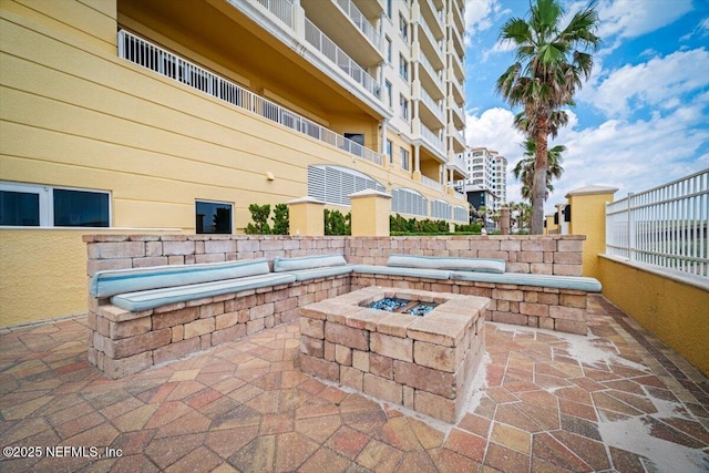 1031 1st St S Unit 1202, Jacksonville Beach, FL 32250 - view of patio featuring an outdoor fire pit