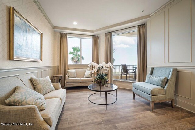 1031 1st St S Unit 1202, Jacksonville Beach, FL 32250 - living room featuring a decorative wall, crown molding, light wood finished floors, and recessed lighting