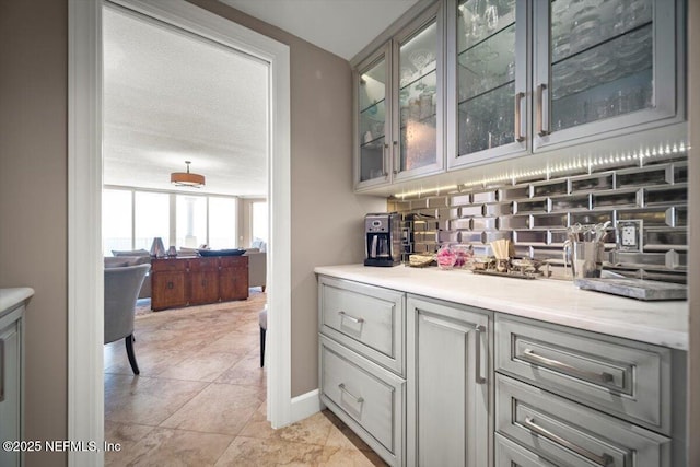 1031 1st St S Unit 1202, Jacksonville Beach, FL 32250 - bar with backsplash and baseboards
