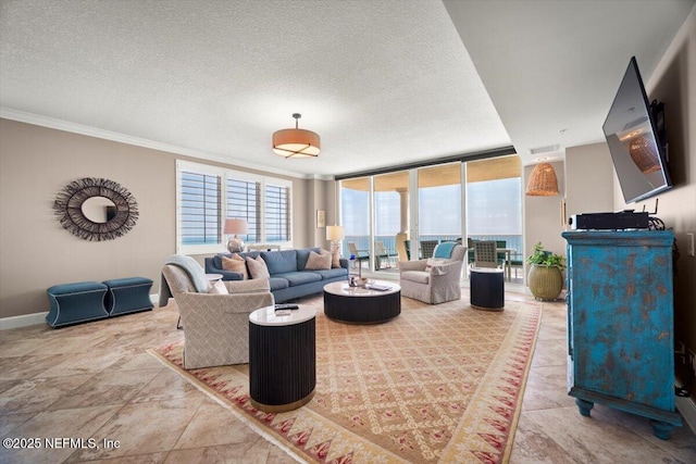1031 1st St S Unit 1202, Jacksonville Beach, FL 32250 - living room featuring crown molding, a textured ceiling, baseboards, and a wall of windows