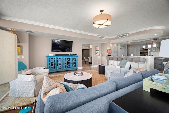 1031 1st St S Unit 1202, Jacksonville Beach, FL 32250 - living area featuring ornamental molding, a textured ceiling, and baseboards