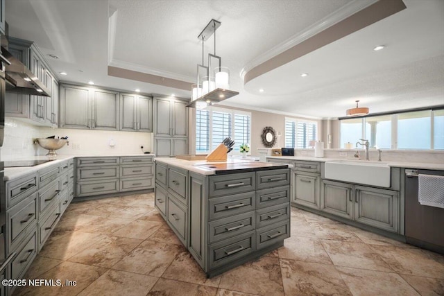 1031 1st St S Unit 1202, Jacksonville Beach, FL 32250 - kitchen with ornamental molding, a sink, gray cabinetry, stainless steel dishwasher, and black electric cooktop