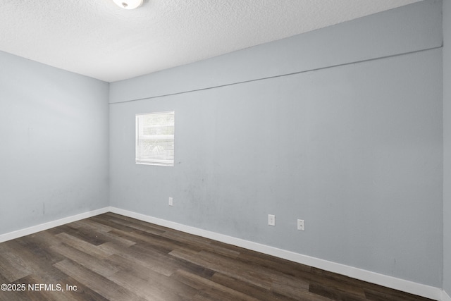 209 E 17th St, Jacksonville, FL 32206 - unfurnished room featuring dark wood finished floors, a textured ceiling, and baseboards