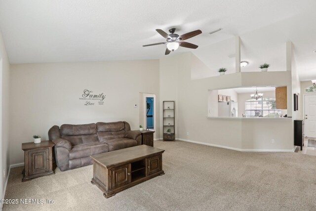 1260 Winding Brook Ct, Middleburg, FL 32068 - living room featuring lofted ceiling, a chandelier, light colored carpet, a ceiling fan, and baseboards